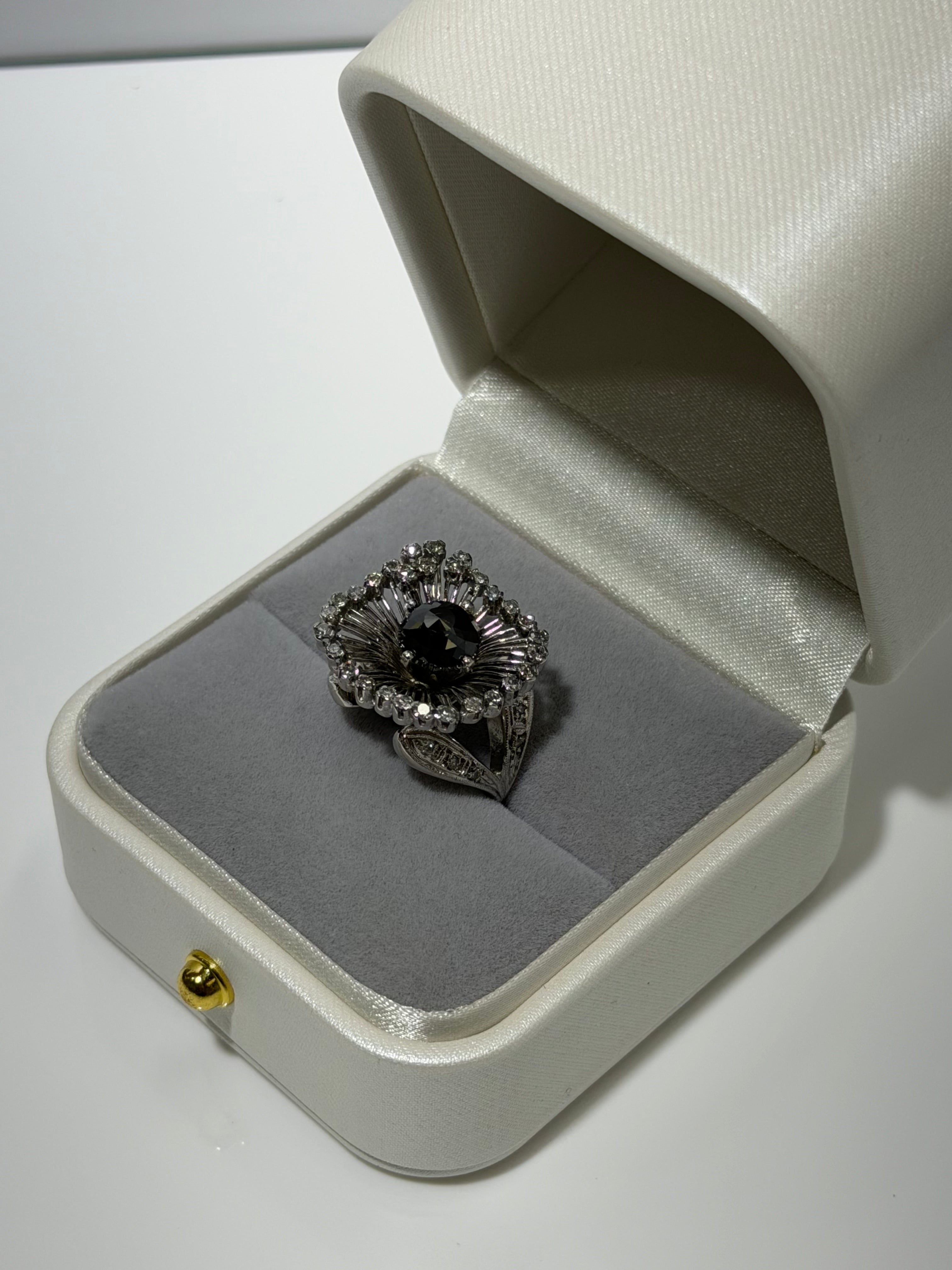 Art Deco Platinum Sunburst Ring (c. 1935–1941) with 1.54 ct Black Diamond & Approx. 1.00 ct Antique Single-Cut Diamond Halo